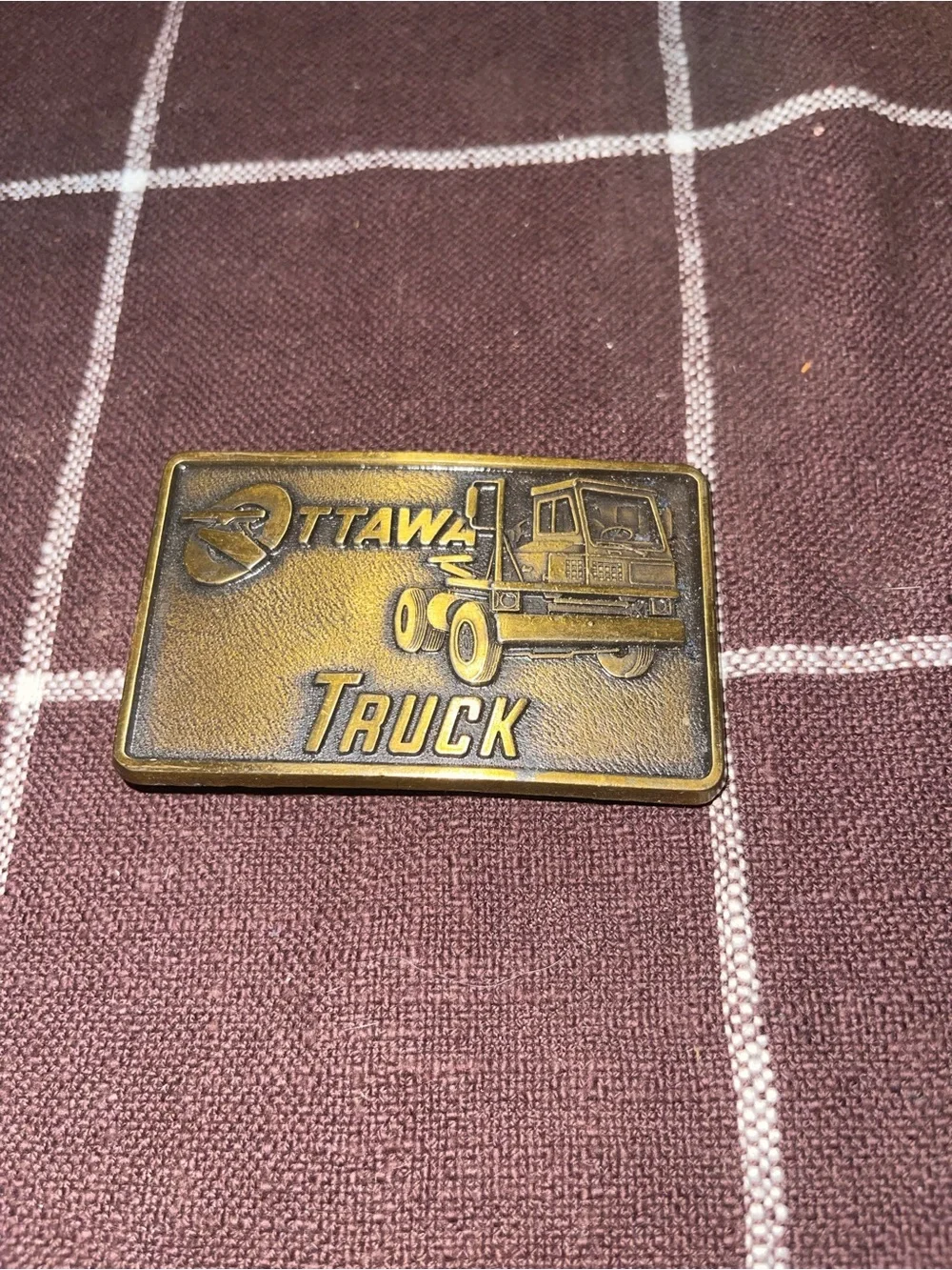 Ottawa Truck belt buckle with truck graphic and 'OTTAWA TRUCK